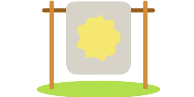 おねしょをした布団を干す