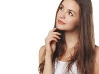 Young beautiful woman thinking looking to the side at blank copy space, isolated over white background