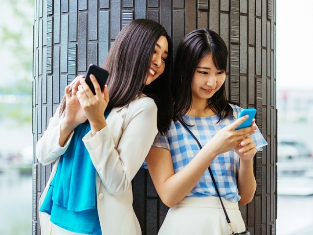 Young women with smart phones