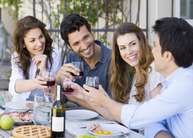 Group Of Happy Young Friends Toasting Wine Glass Outdoor While Having Lunch