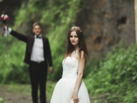 Beautiful bride posing near rocks with beautiful views.