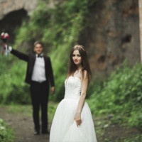 Beautiful bride posing near rocks with beautiful views.