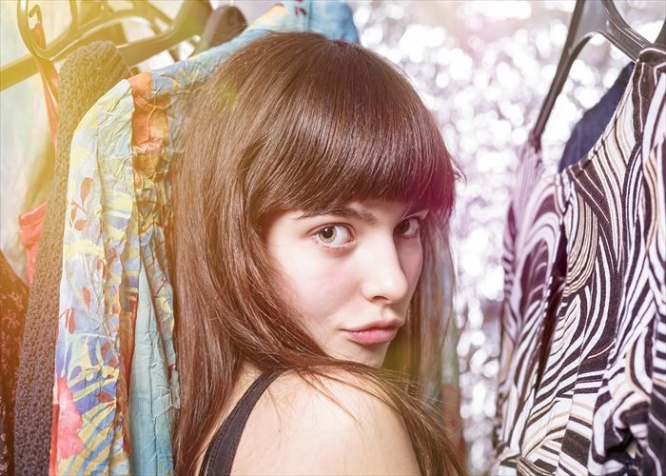 perky teenage girl and her wardrobe, toned image, bokeh, light leak