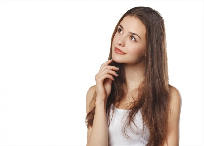 Young beautiful woman thinking looking to the side at blank copy space, isolated over white background