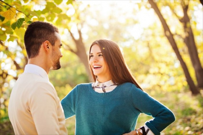 Happy loving young couple at the park