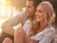 two lovers at santa monica beach holding each other