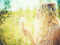 Beautiful blonde with dandelions
