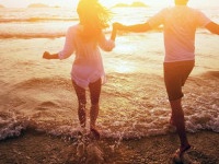 happy couple on the beach, summer vacations or honeymoon