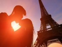 silhouette of romantic lovers with eiffel tower in Paris with sunset