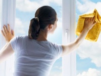 young woman washing windows