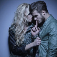 young fashion woman embracing her thoughtful boyfriend