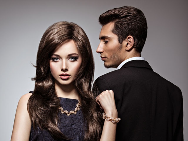 Studio portrait of young beautiful couple in love