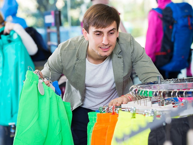 Man picking a sport clothes