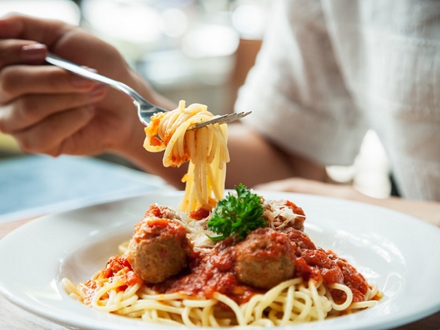 woman eating spaghetti