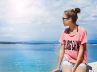 Teenage girl looking at the sea
