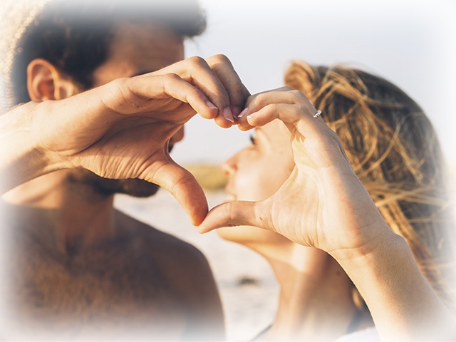 Young Couple In Love On The Beach