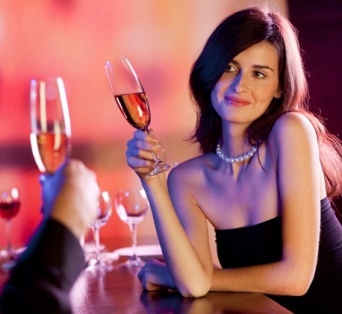 Couple on romantic date or celebrating together at restaurant
