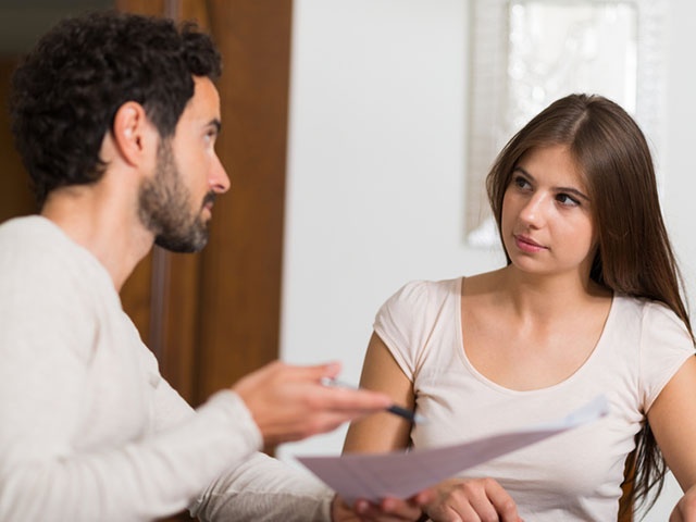 Couple calculating their expenses