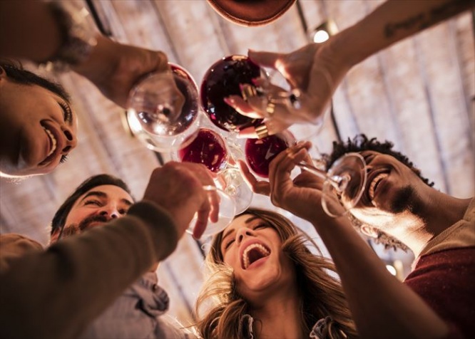 Low angle view of happy start up team toasting to their success.