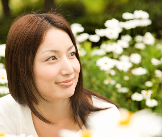 Woman surrounded by flowers
