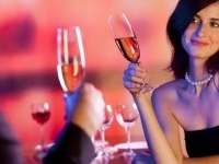 Amorous couple on romantic date or celebrating together at restaurant