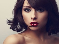 Bright makeup beautiful woman with short black hair style looking. Closeup vintage portrait