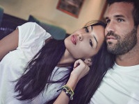 Couple in love looking trough window of a coffeeshop