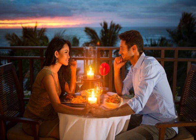 Romantic couple have dinner with sunset and candlelight outdoor, concept love, relationship and romantic