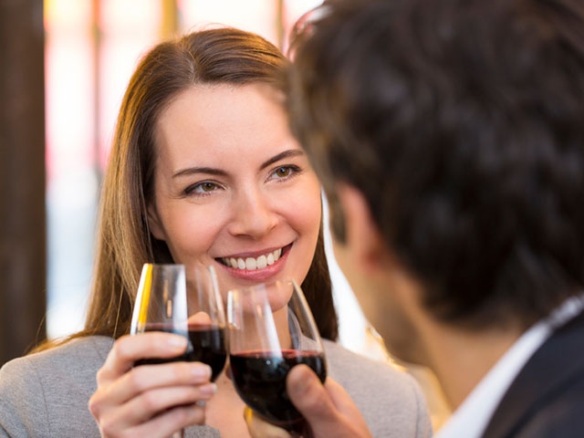 Loving couple takes a drink in restaurant