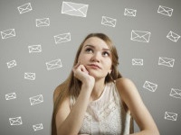 Girl in white looking at the letters