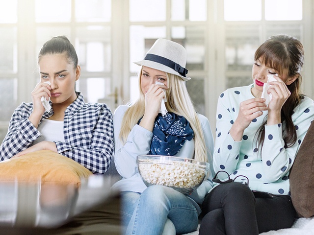 Young women crying together