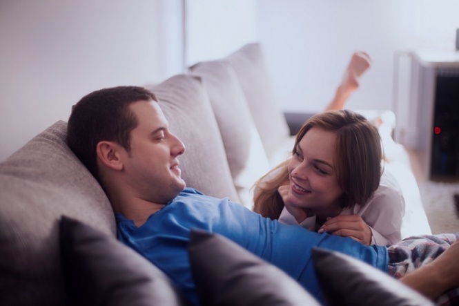 Lovely couple in pyjamas spending Valentine's day at home