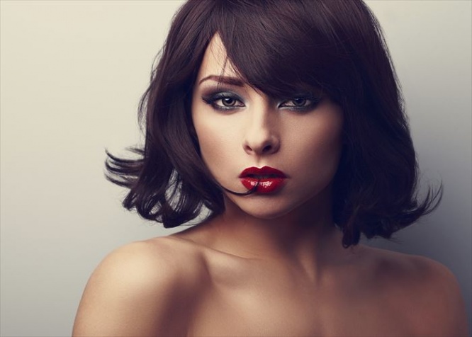 Bright makeup beautiful woman with short black hair style looking. Closeup vintage portrait