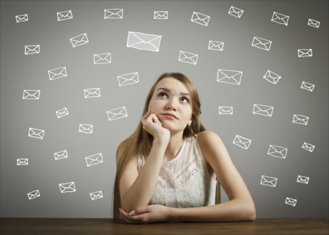Girl in white looking at the letters