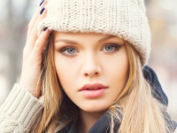 Blonde with hand next to head