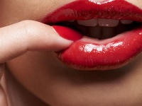 Cropped shot of a woman pressing her finger against her lip