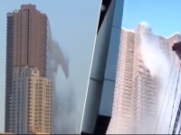 高層マンションの屋上プールが壊れ、大量の水が滝のように落下。地震による被害（フィリピン）