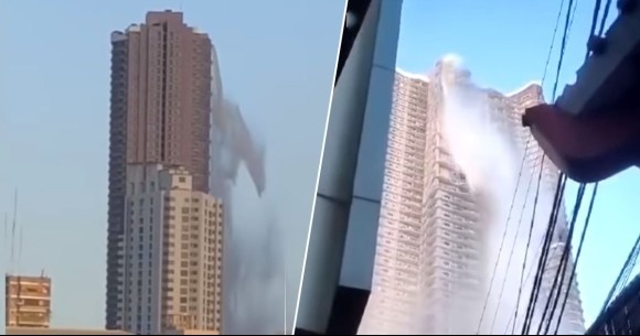 高層マンションの屋上プールが壊れ、大量の水が滝のように落下。地震による被害（フィリピン）
