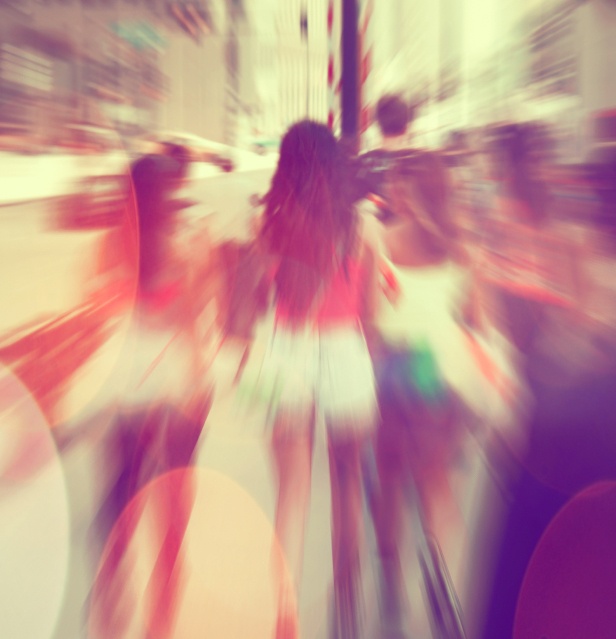Commuters crossing at rush hour, blur motion.