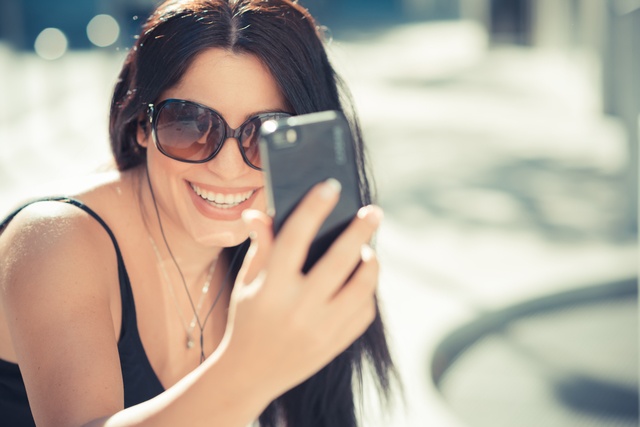 beautiful long black hair elegant business woman using smartphon