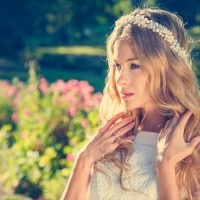 Charming Bride with Wedding Tiara on Nature Background. Modern Bridal Style. Toned Photo with Copy Space.