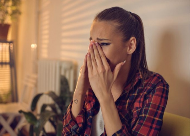 Young woman having problems and crying.