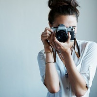 Cropped shot of a young woman taking a photo with a vintage camerahttp://195.154.178.81/DATA/i_collage/pu/shoots/805862.jpg