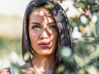 Young woman with green eyes in urban background