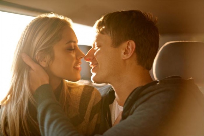 Shot of an affectionate young couple about to kiss in a car