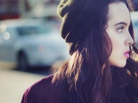 Stock image portrait of urban teen walking outdoors with a blank stare