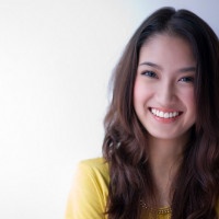 A beautiful asian girl is smiling