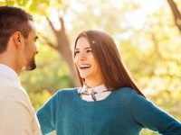 Happy loving young couple at the park