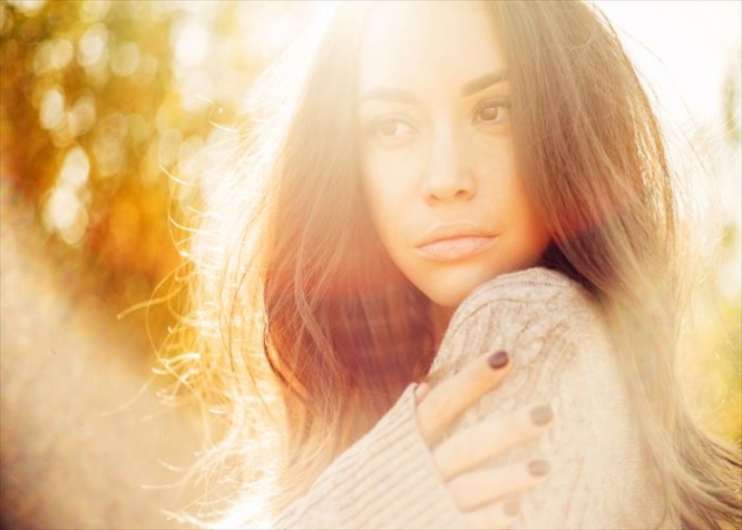 Outdoor atmospheric fashion photo of young beautiful lady in autumn landscape