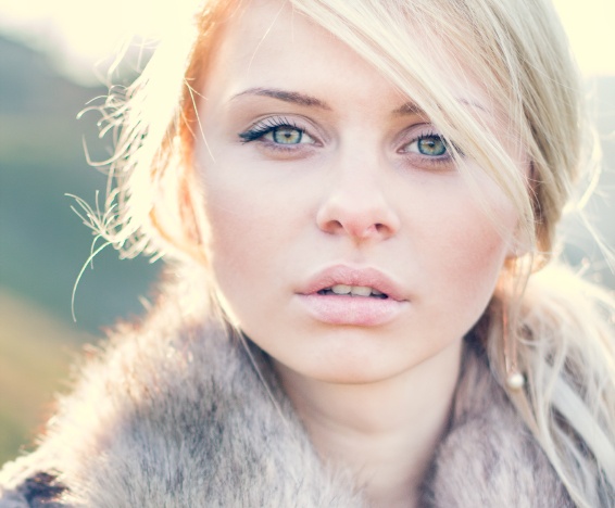 Beautiful girl portrait outdoor in sunny weather